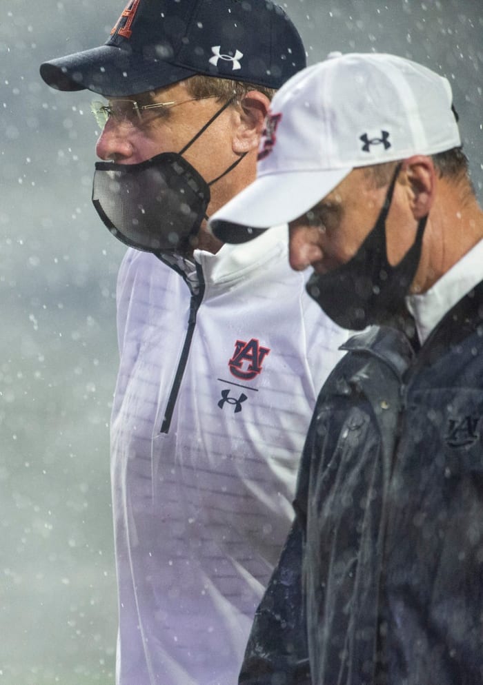 Auburn coach Gus Malzahn and offensive coordinator Chad Morris walk off the field at Jordan Hare Stadium in Auburn, Ala., on Saturday, Oct. 10, 2020. Auburn defeated Arkansas 30-28.